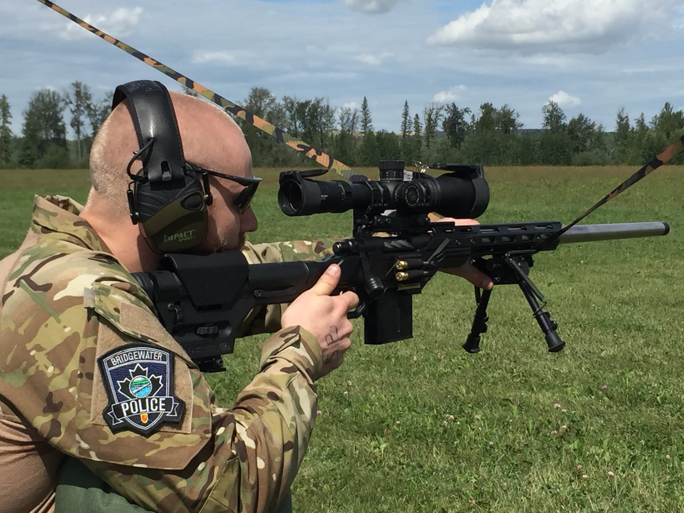 A police officer training with a precision rifle on the NSSR range